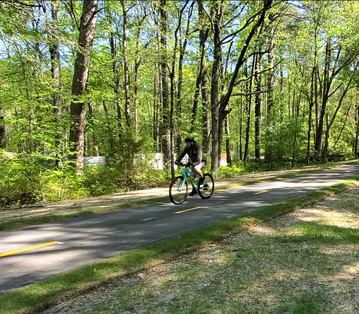 A cyclist on the Southwest Trail, a part of the Regional Greenway trail system.