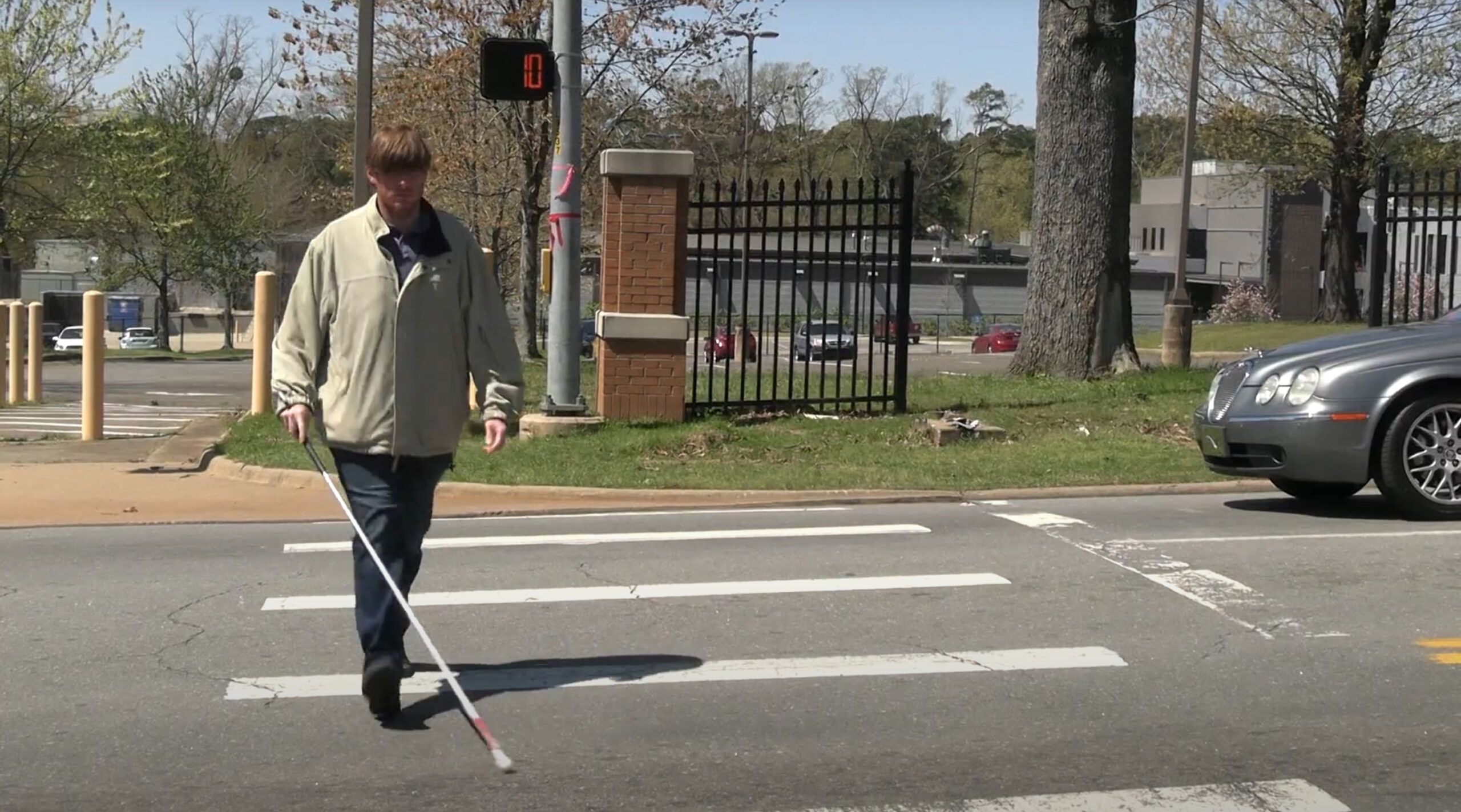 A blind person crossing the street