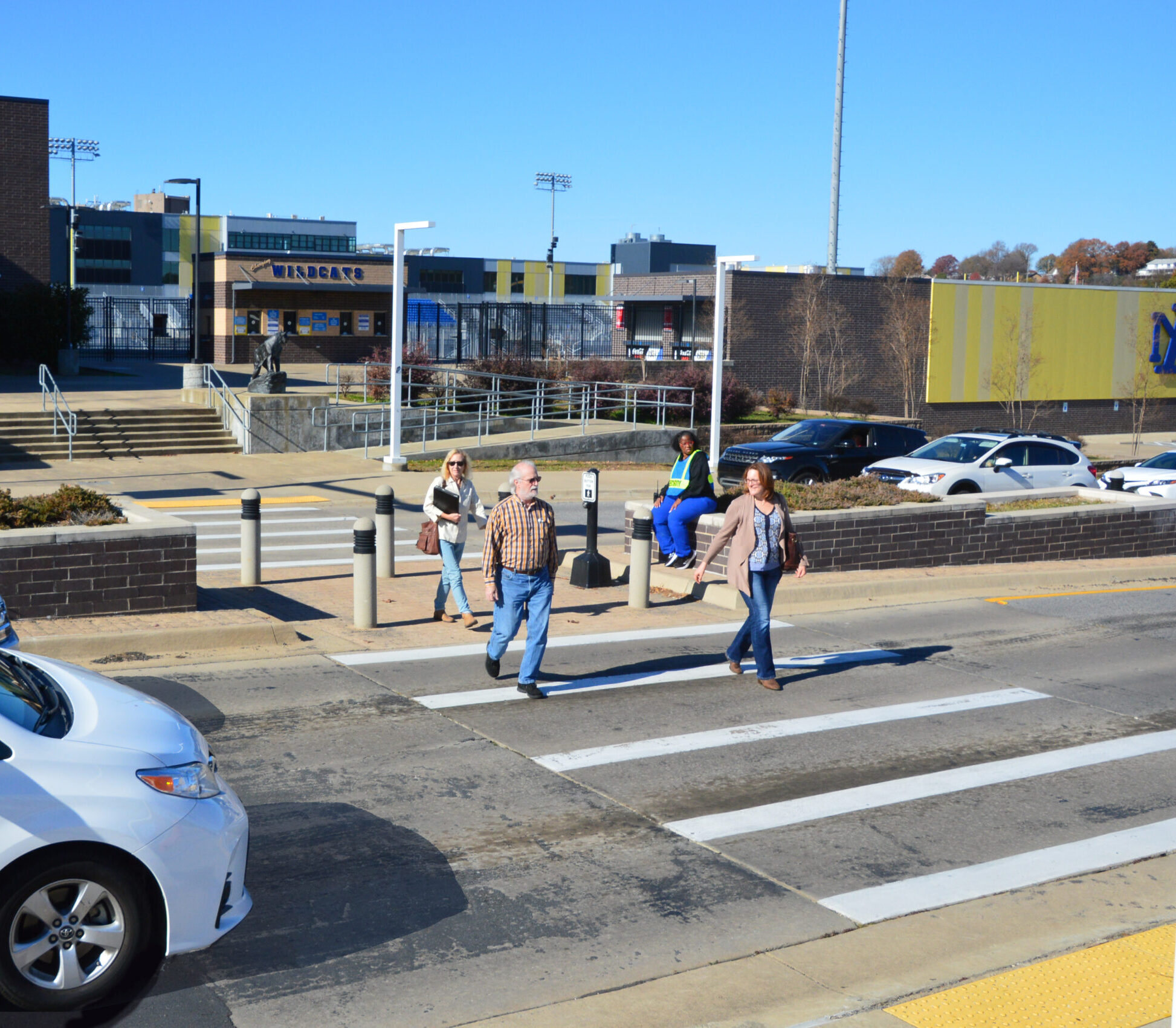 Pedestrians crossing the street at a crosswalk
